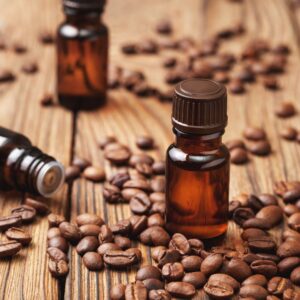 coffee beans with containers of oil